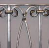 Detail view of wrought iron balustrade on your left