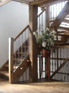 Textured drop forged wrought ironwork balustrade and Welsh oak staircases