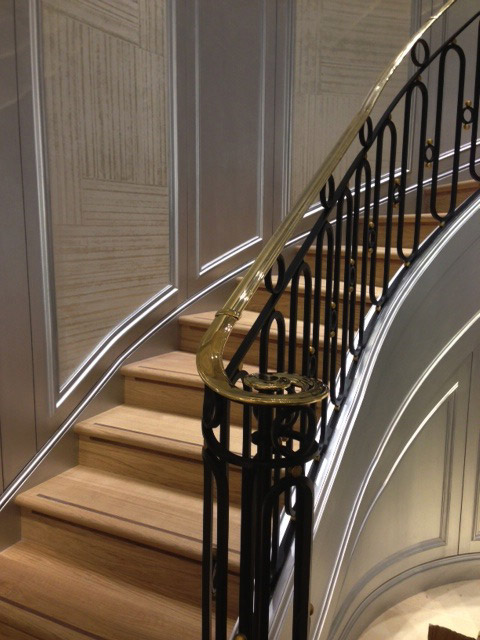 Circular cast iron staircase in Christian Dior retail shop in London.