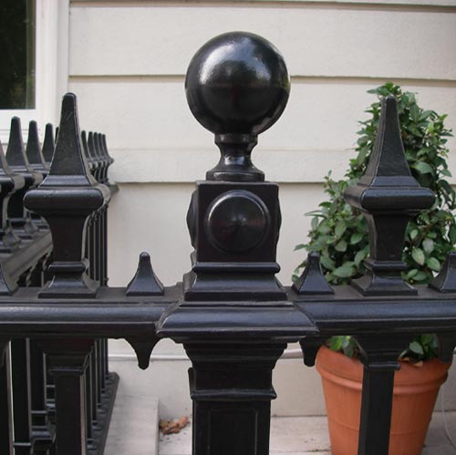 Genuine cast iron finials finish these iron railings