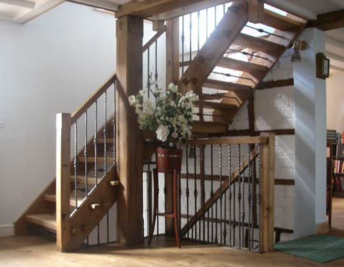 Welsh oak staircases with drop forged wrought ironwork balustrade