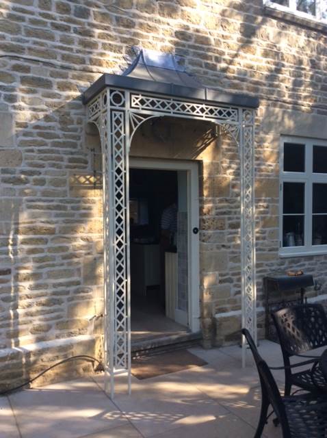 Wrought Iron Traditional Georgian style Porch awning finished in a custom cream colour with Zinc Canopy Roof Cover Leaded and Spandrel Brackets