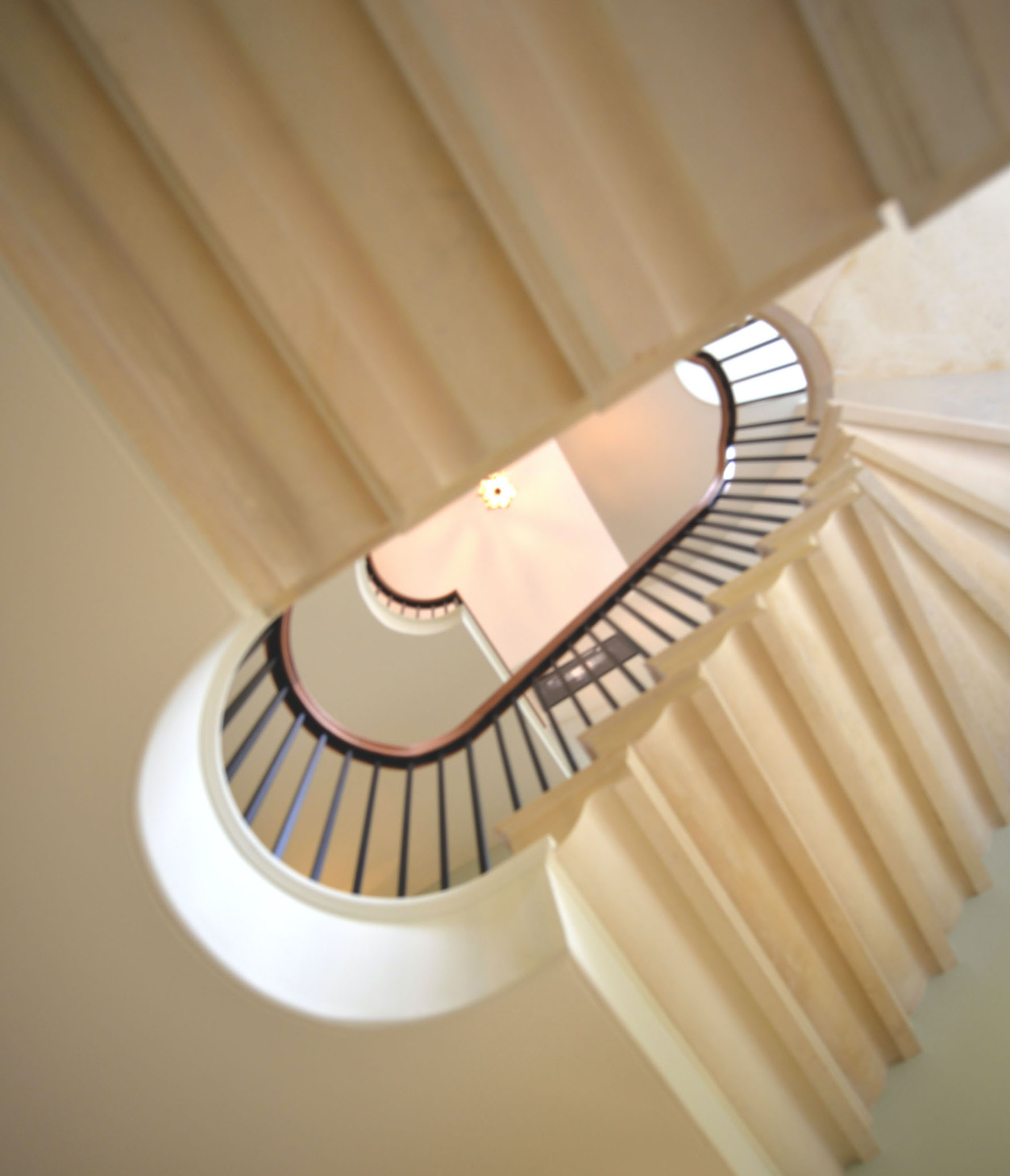 Elegant metal staircase railing with hand carved oak handrail