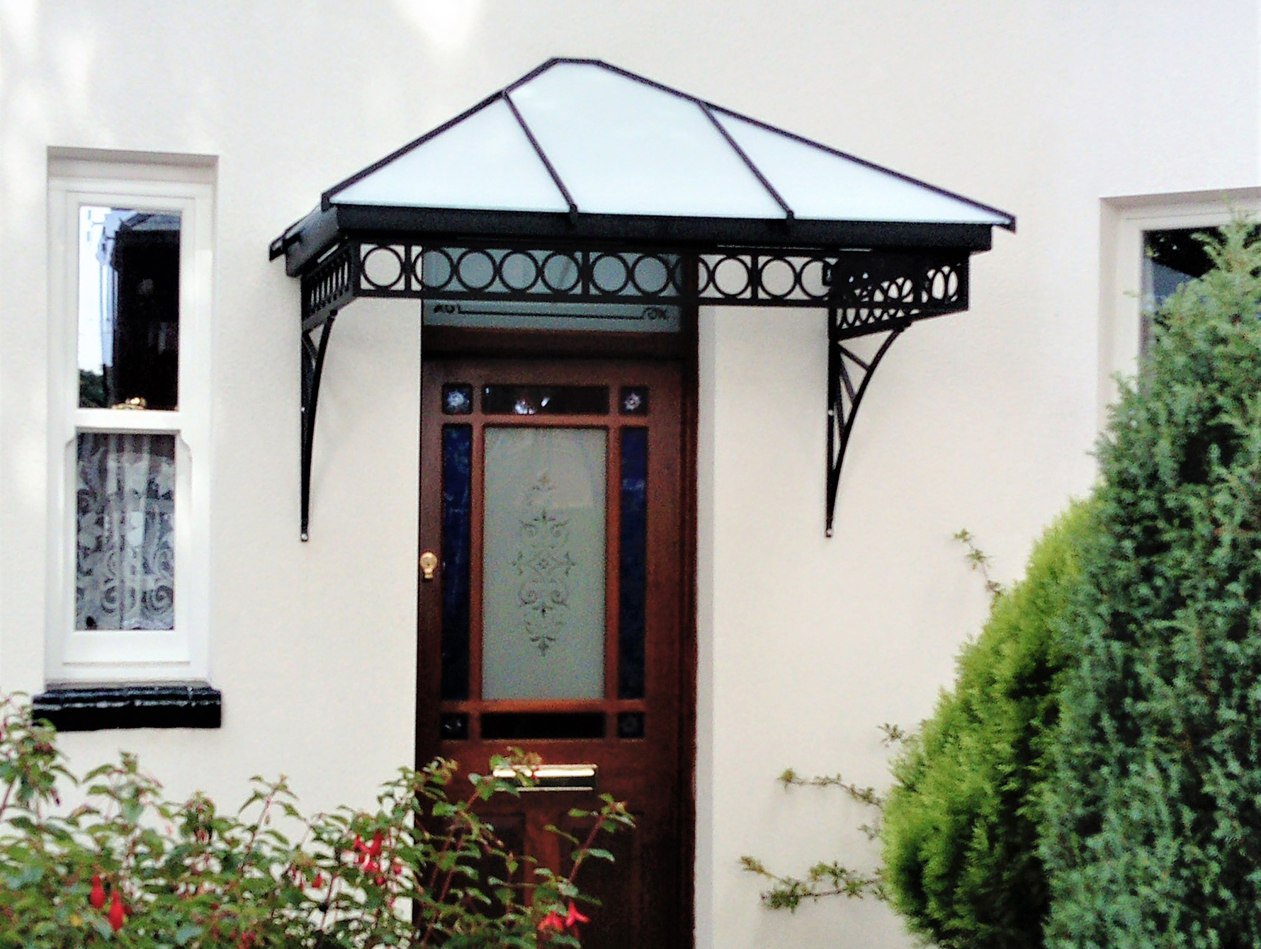 A straight and hipped canopy roof finished with opaque glass