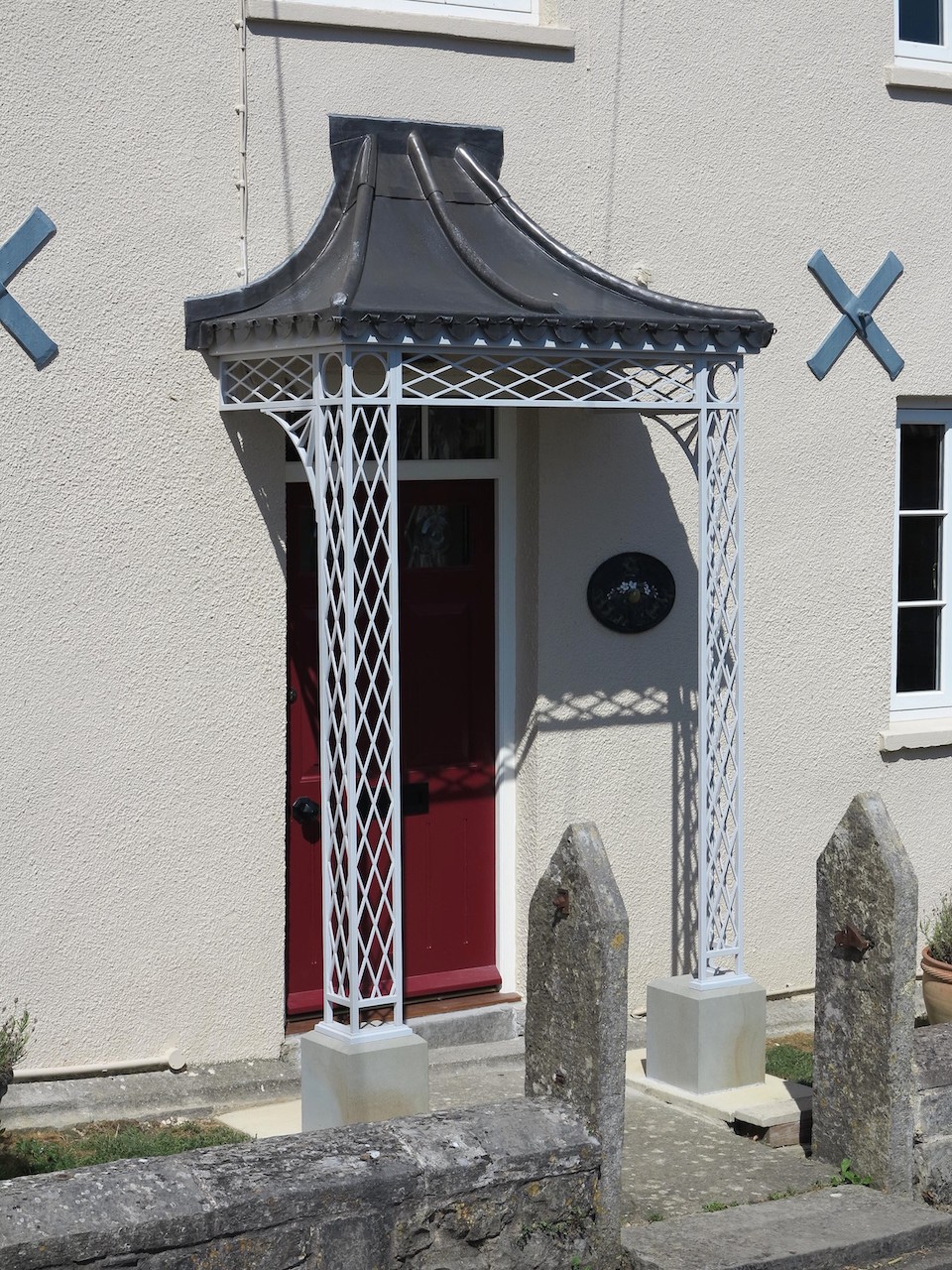 Ironwork Porch with stone plinths and lead roof